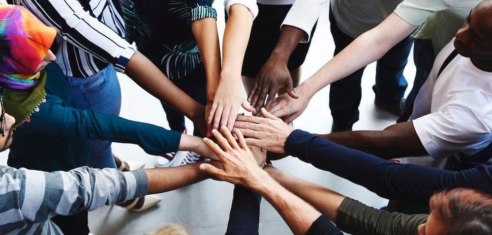 diversity-teamwork-with-joined-hands-2022-09-16-07-58-06-utc.jpg