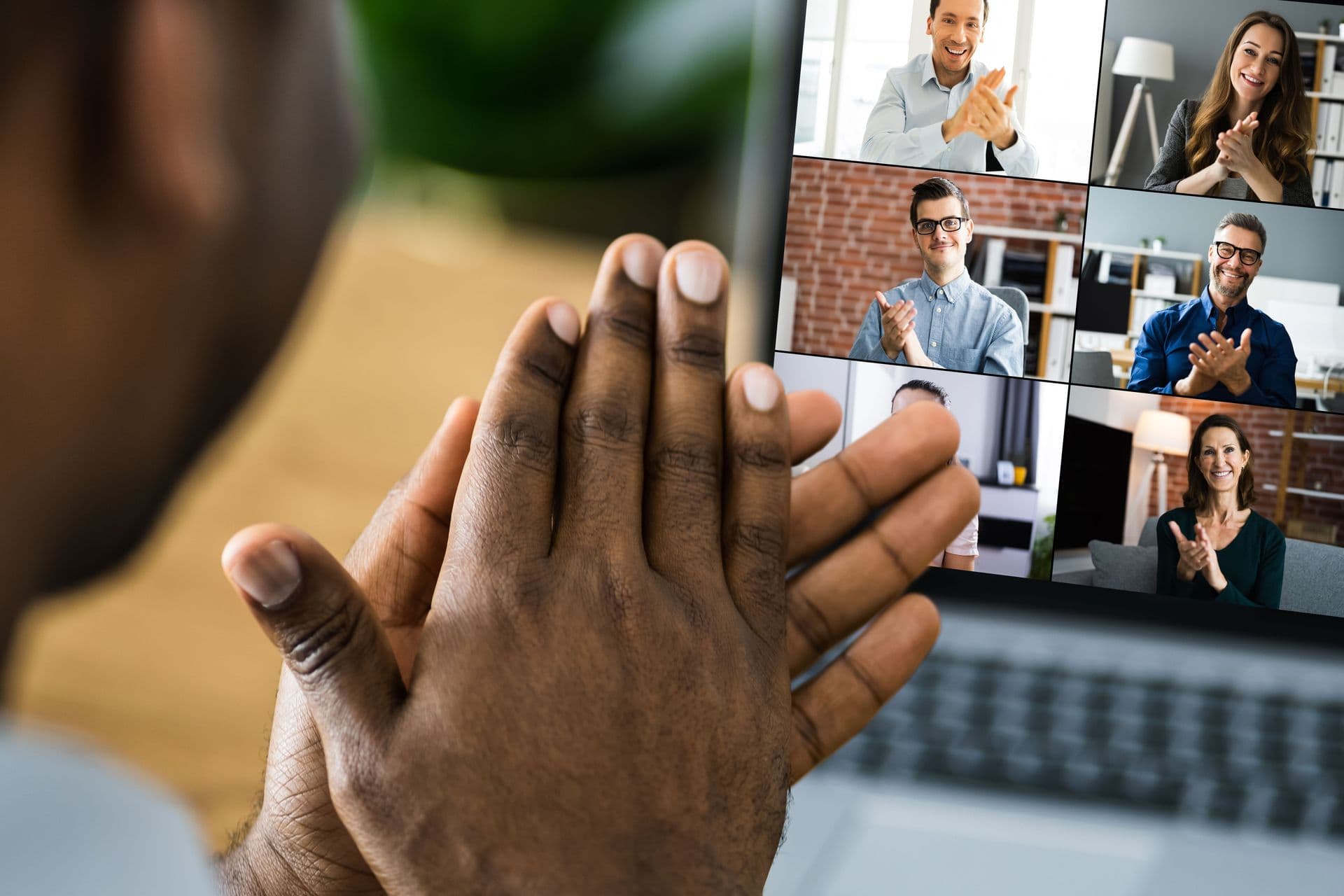 Businessman-participating-in-a-virtual-team-meeting-via-video-conference-on-laptop-screen